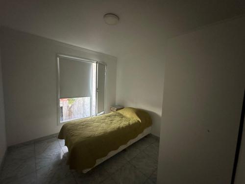 Giường trong phòng chung tại Colinas de Peralta Ramos