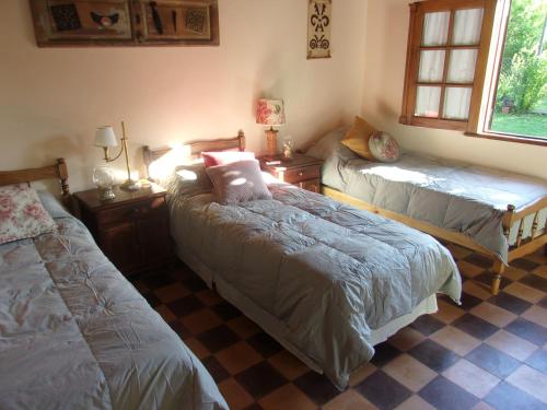 Postel nebo postele na pokoji v ubytování La Posada de Don Segundo