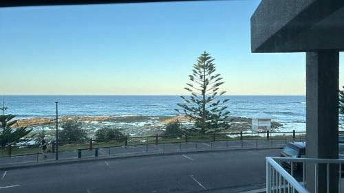 a view of the ocean from a balcony at Uninterrupted Ocean & Channel Views in The Entrance