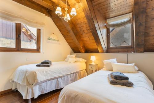 Кровать или кровати в номере M1 eraclau - Era Candèla con garage y WiFi en Vielha