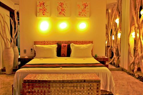a bedroom with a large bed in a room at The Zala Villa in Canggu