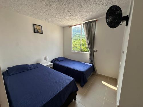 Ένα ή περισσότερα κρεβάτια σε δωμάτιο στο Apartamento Moderno en Apulo