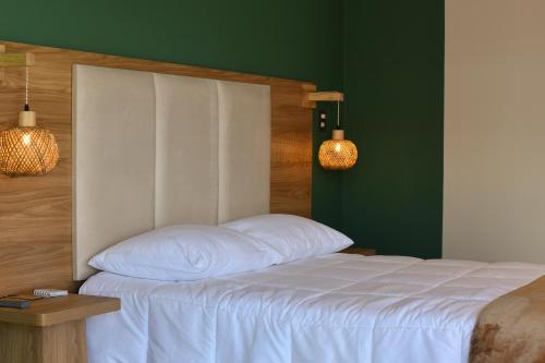 Ένα ή περισσότερα κρεβάτια σε δωμάτιο στο Phuyu Hotel