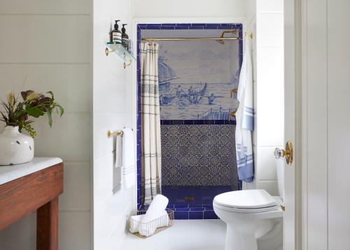 a bathroom with a toilet and a shower at Greydon House in Nantucket