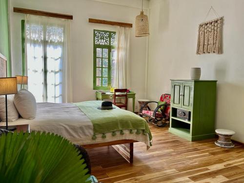 Ένα ή περισσότερα κρεβάτια σε δωμάτιο στο The Apsara