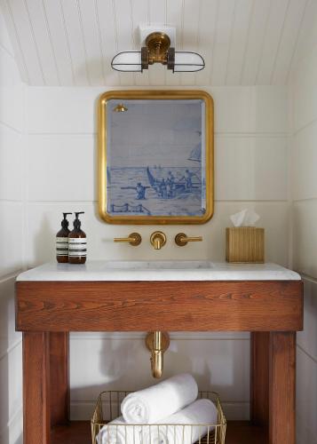 a bathroom with a sink and a mirror at Greydon House in Nantucket