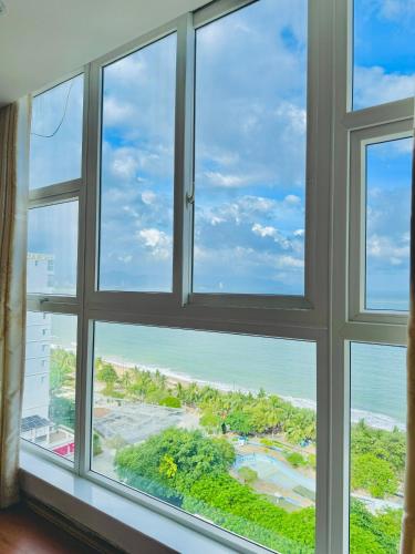an open window with a view of the ocean at Paris Luxury Hotel & Apartment Nha Trang in Nha Trang