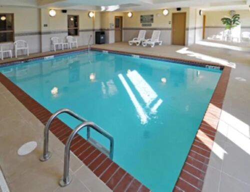 a large swimming pool in a hotel room at Country Inn & Suites by Radisson, Conway, AR in Conway