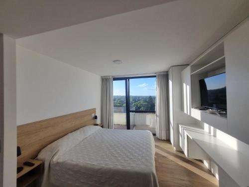 En eller flere senge i et værelse på EG12 Playa Grande Aloha Host