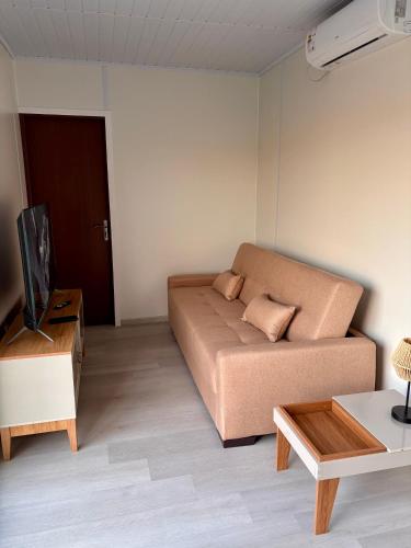 a living room with a couch and a table at Tres de Mayo in San Luis