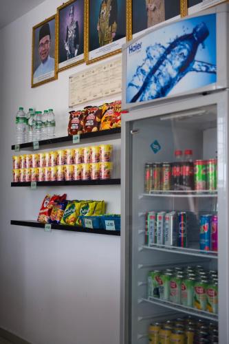 a refrigerator filled with lots of food and drinks at T Hotel Tandop in Alor Setar