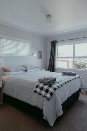 a bedroom with a large bed with a window at Sweet on Sutton in Richmond