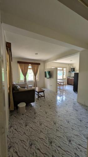 a living room with a couch and a table at Apartment in kathmandu in Kathmandu