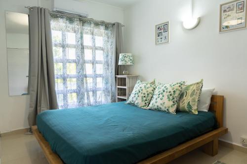 En eller flere senge i et værelse på Résidence du Moulin