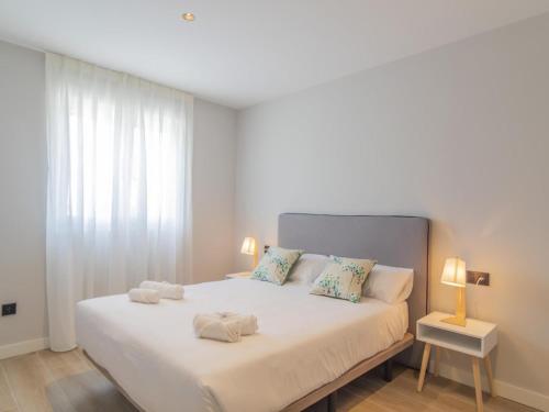 En eller flere senge i et værelse på Apartamento Mar Salada Rosamunda