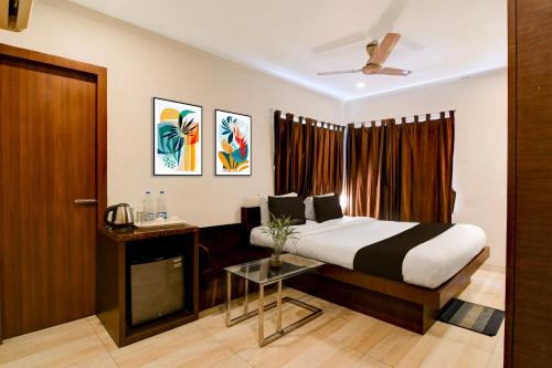 Postel nebo postele na pokoji v ubytování Super Townhouse New Digha Formerly Hotel Coral