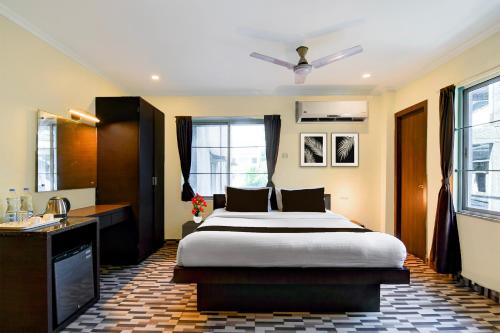 Postel nebo postele na pokoji v ubytování Super Townhouse New Digha Formerly Hotel Coral