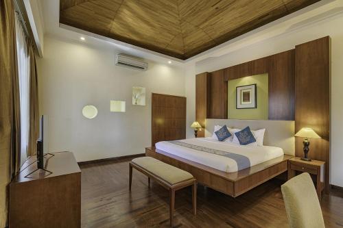 Ένα ή περισσότερα κρεβάτια σε δωμάτιο στο The Beverly Hills Bali Villas Jimbaran