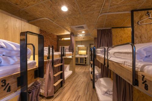 Postel nebo postele na pokoji v ubytování Beimen WOW Poshtel