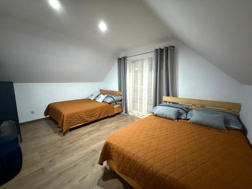 Postel nebo postele na pokoji v ubytování Domek Matyjówka