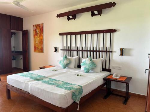 En eller flere senge i et værelse på The Long Beach Resort & Spa