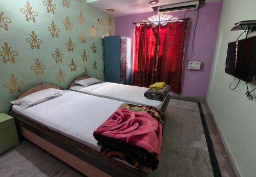 Postel nebo postele na pokoji v ubytování Hotel O B. S Marriage Palace