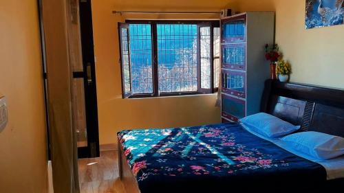 Letto o letti in una camera di Asha's homestay