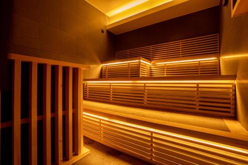 an empty room with blinds on a window with lights at Rairin in Hiroshima