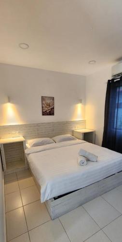 Postel nebo postele na pokoji v ubytování Village Hideaway Suites Langkawi