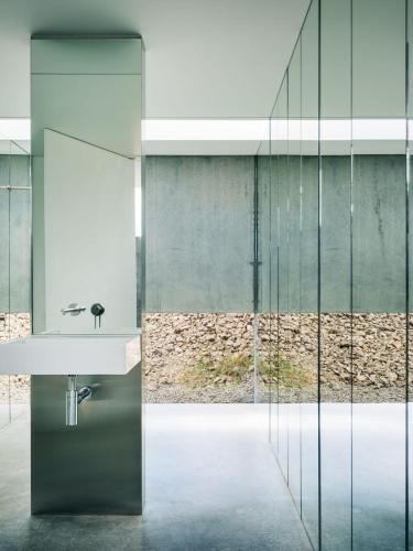 a bathroom with a sink and a mirror at Triptych - The Blunt House in Koonya