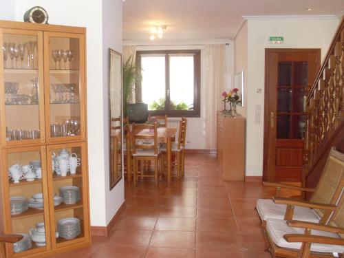 a living room with a table and a dining room at Casa Rural Reparaz in Arbizu