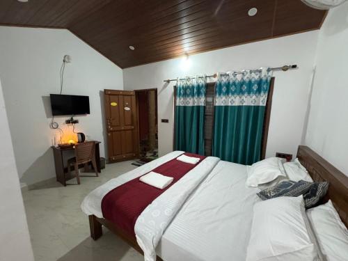 Giường trong phòng chung tại Manuvan Estate Stay