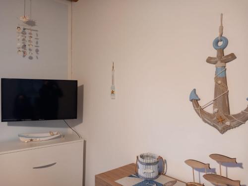 TV a/nebo společenská místnost v ubytování Casa Del Pescatore