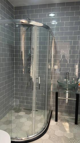 a bathroom with a shower and a sink at Gyumri Heritage House in Gyumri