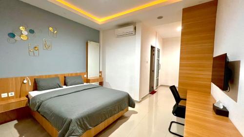 Postel nebo postele na pokoji v ubytování studio suryajingga