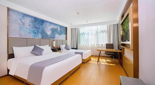 Postel nebo postele na pokoji v ubytování GreenTree Inn Taiyuan PinGYAng Road Business Hotel