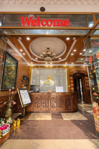 a welcome sign in the front of a store at Nhật Tân Hotel in Hanoi