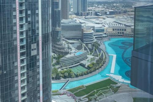 an aerial view of a city with tall buildings at Vogue Vacation Homes, Downtown Opera Grand near Burj Khalifa and Dubai Mall, Two Bedroom Apartment with Large Balcony and Access to all Amenities in Dubai