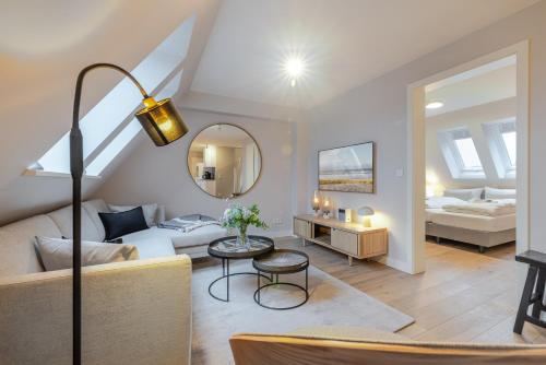 En eller flere senge i et værelse på Strandgut Wohnung 8