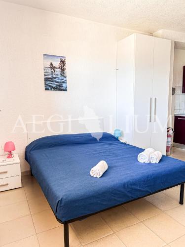 Giường trong phòng chung tại Pesciolino Rosso