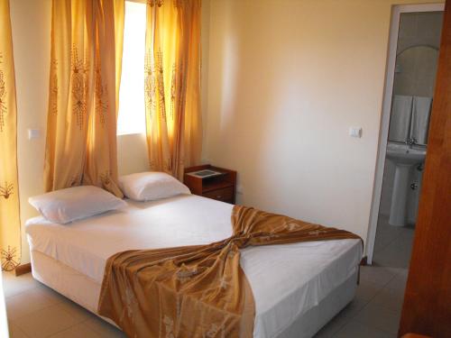 Postel nebo postele na pokoji v ubytování Hotel Lazareto