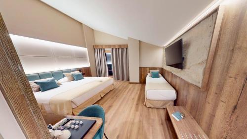 Postel nebo postele na pokoji v ubytování Hotel Princesa Parc Excellence