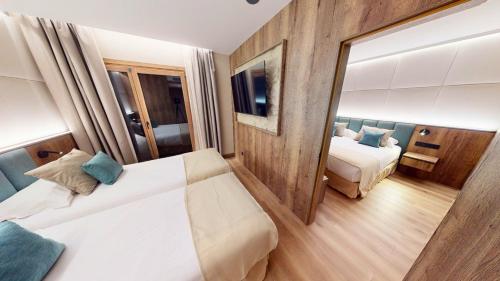 Postel nebo postele na pokoji v ubytování Hotel Princesa Parc Excellence