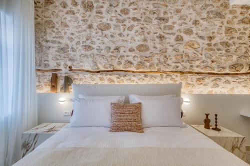 Giường trong phòng chung tại Nalia Suites