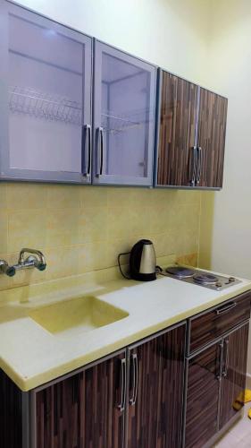 Η κουζίνα ή μικρή κουζίνα στο أرقي خيال للاجنحة الفندقية