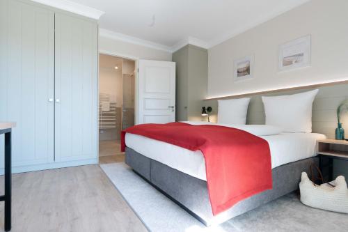 En eller flere senge i et værelse på Apartmenthaus Resort Kranichsruh