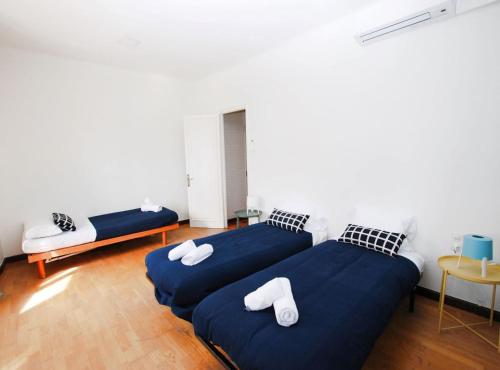 En eller flere senge i et værelse på La casa del Pi · La casa del Pi · House in the city, next to Barcelona and beach