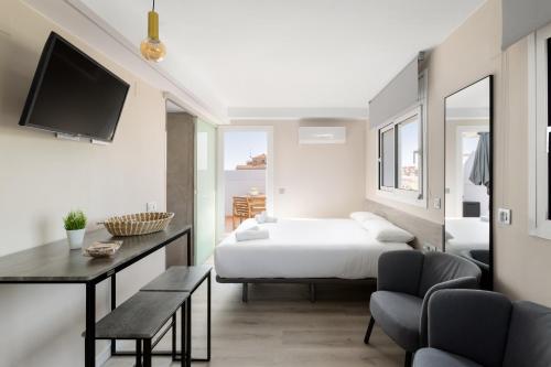 Postel nebo postele na pokoji v ubytování Aparthotel Vilassar