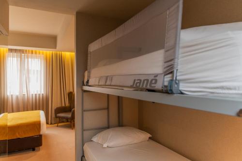 En eller flere senge i et værelse på WOT Porto Soul