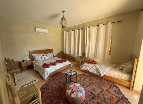 Ένα ή περισσότερα κρεβάτια σε δωμάτιο στο Najma Ourika